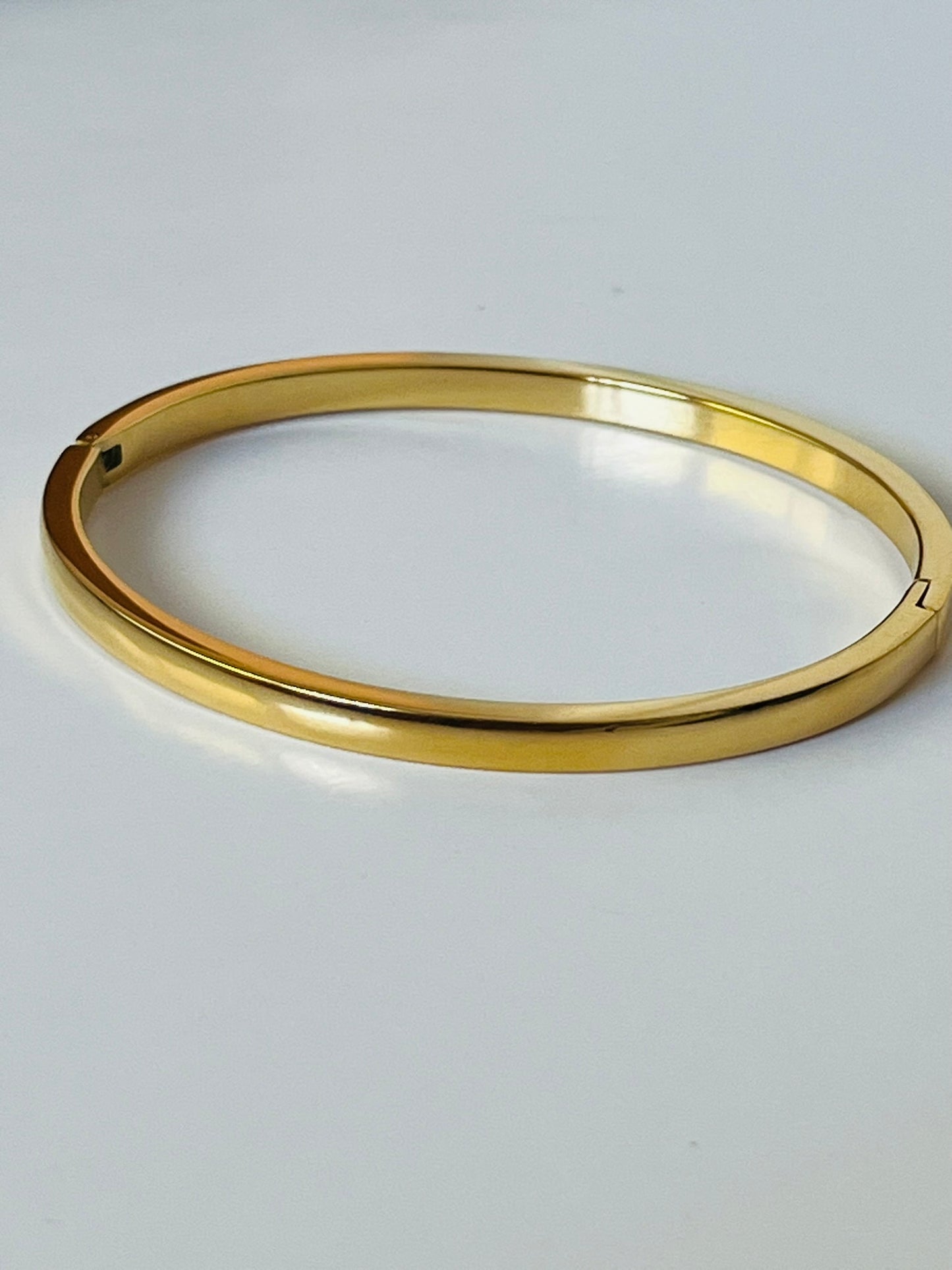 Athena stainless steel clip on gold bangle
