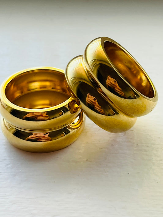 Gold ring with rounded edges.