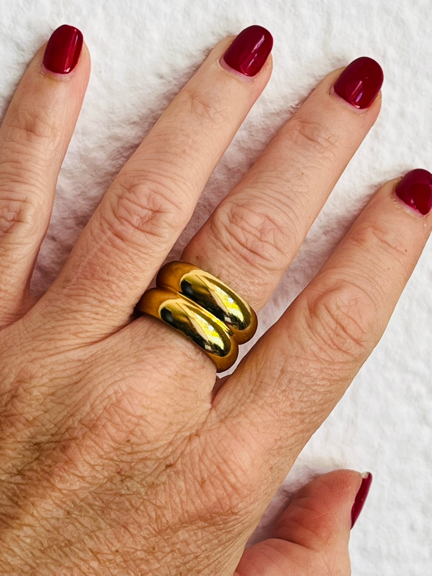 Hand with chunky gold statement ring