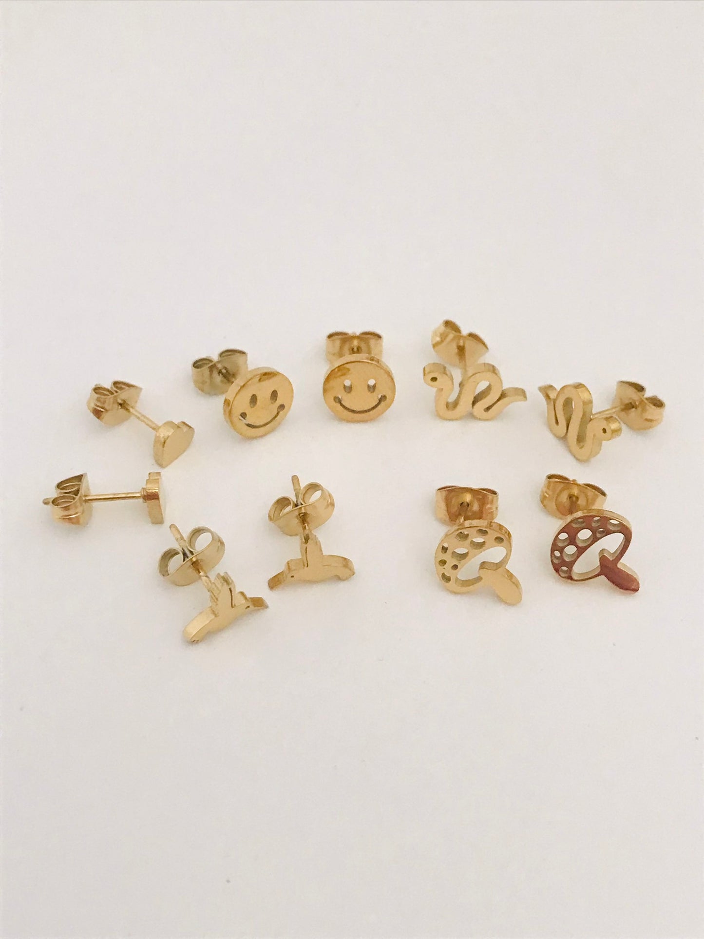 Heart shaped gold stud earrings