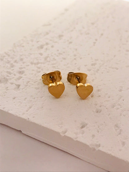 Heart shaped gold stud earrings