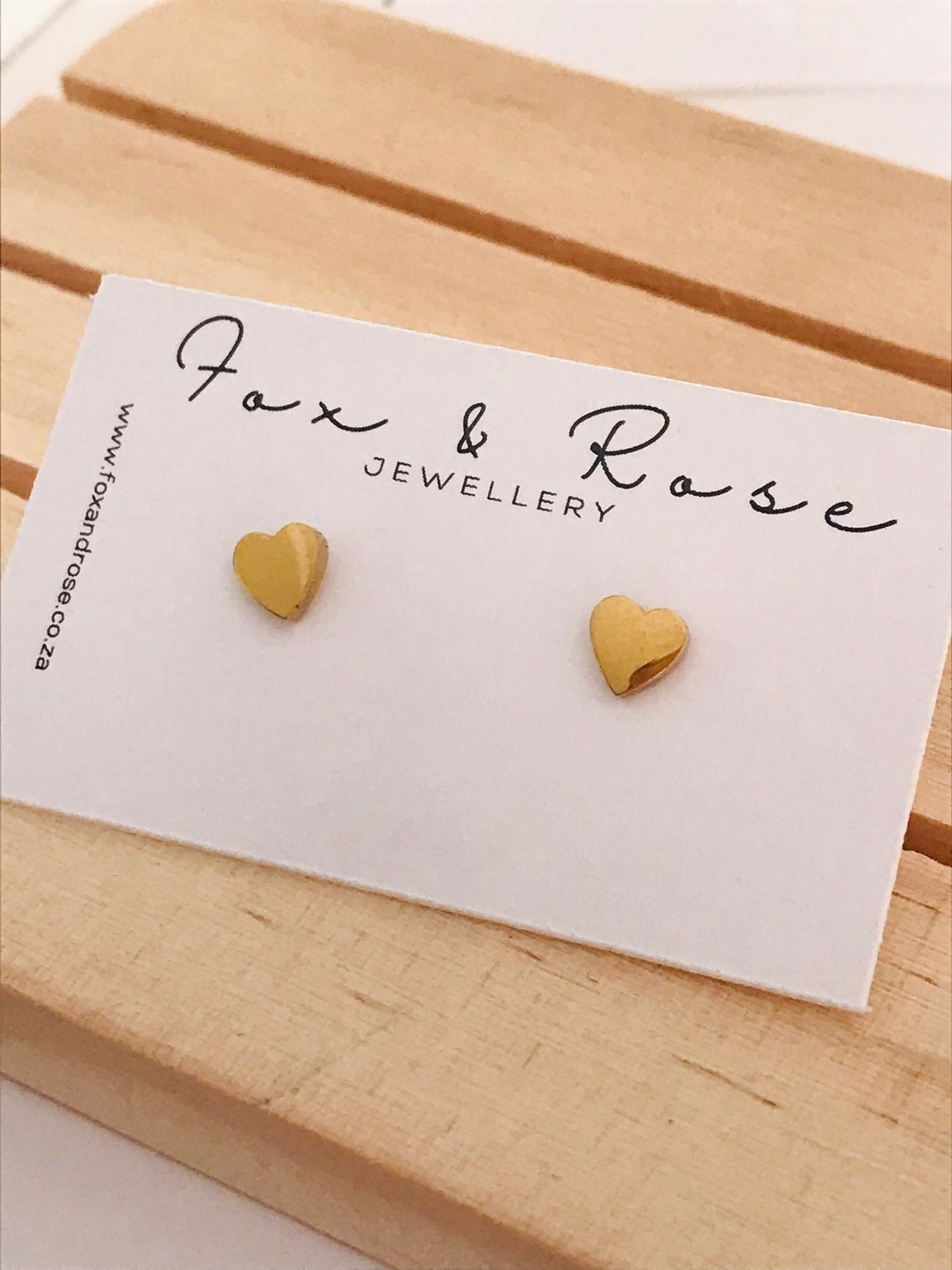 Heart shaped gold stud earrings