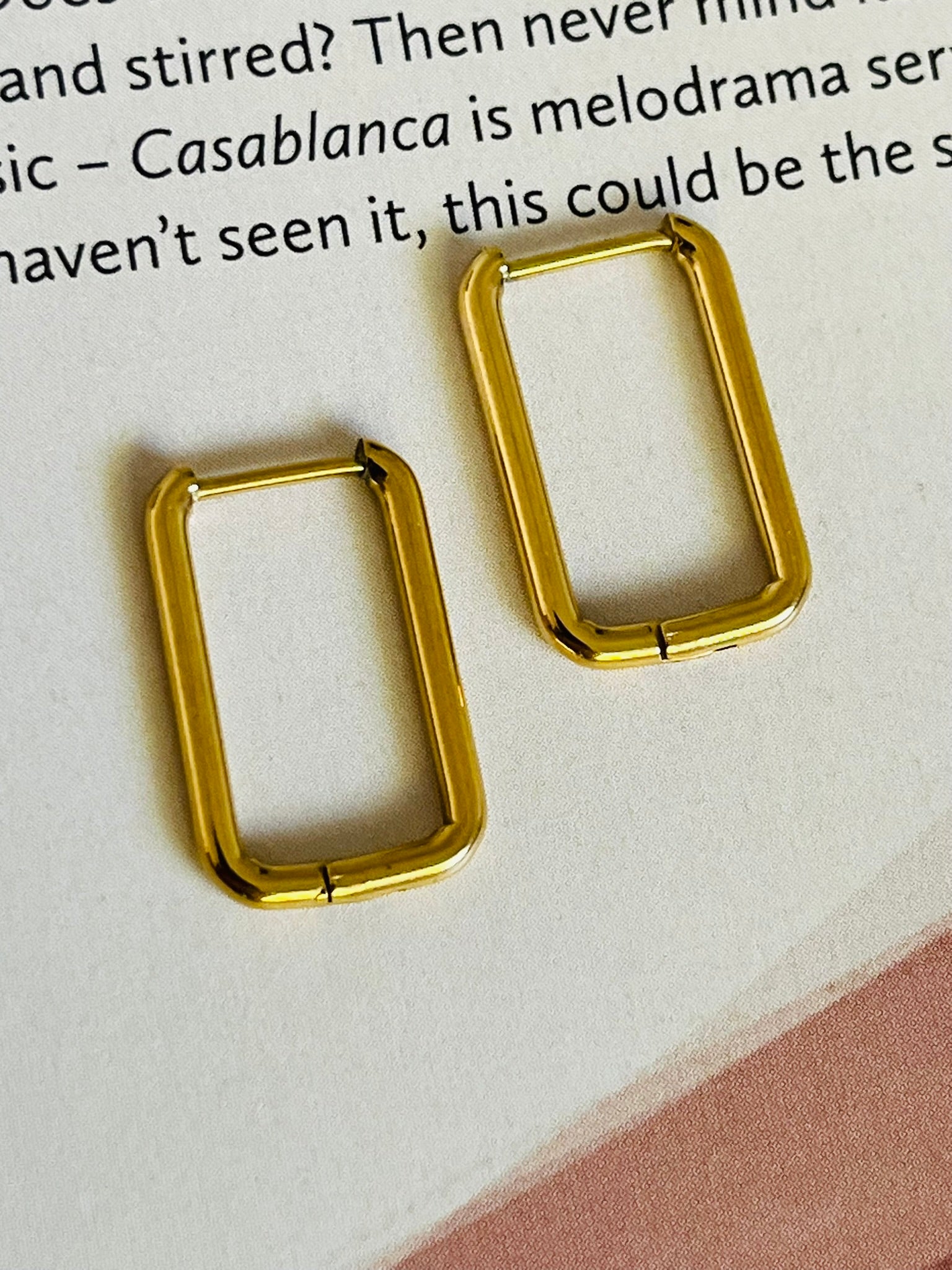 Rectangular shape gold hoop earrings, that are edgy and stylish to wear.