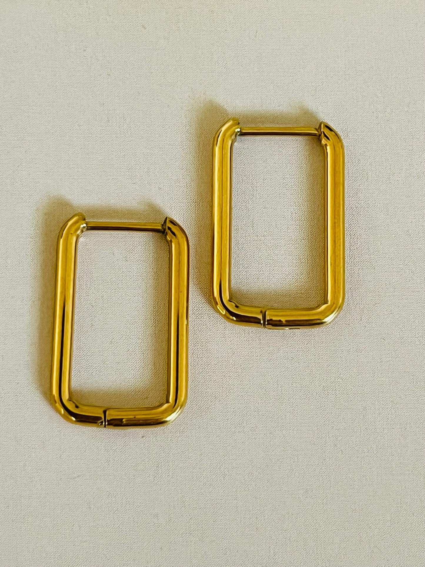 Edgy and stylish rectangular shaped gold hoop earrings that are tarnish and waterproof and hypoallergenic