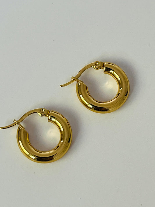 Gold chunky mini gold hoop earrings with a clasp. Waterproof, tarnish proof and hypoallergenic. 