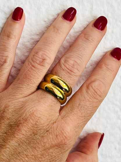 Hand with chunky gold statement ring 