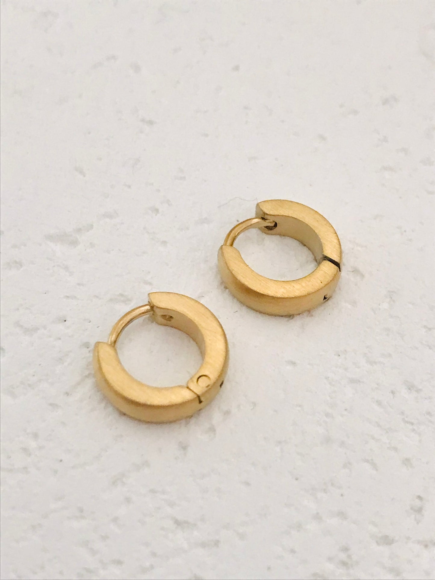 Della tiny huggie earrings
