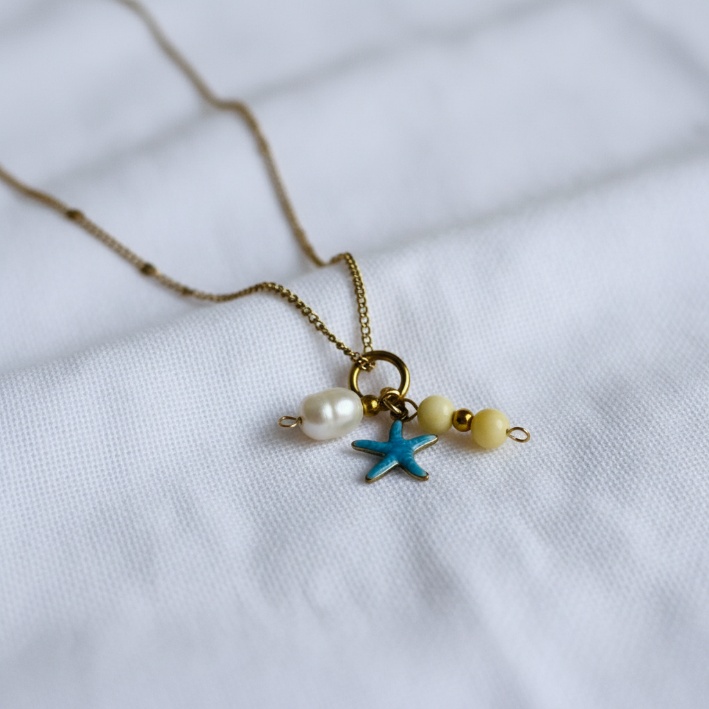 Coastal Wanderer Necklace Draped Over Linen Folds