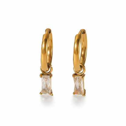 Lydia gold hoop earrings with rectangular baguette crystal pendant, pure white background