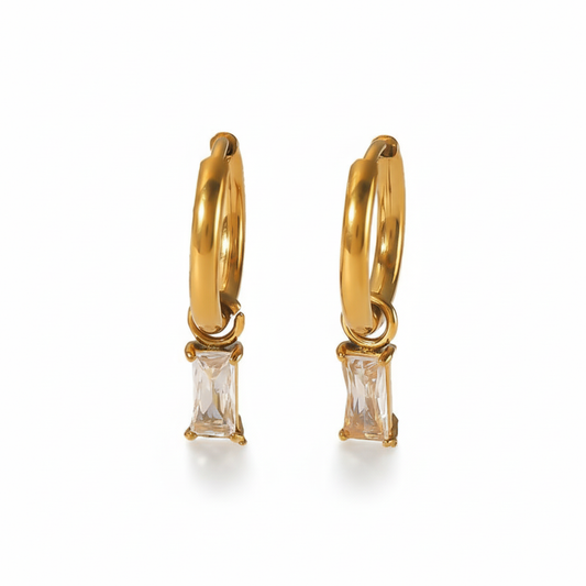 Lydia gold hoop earrings with rectangular baguette crystal pendant, pure white background