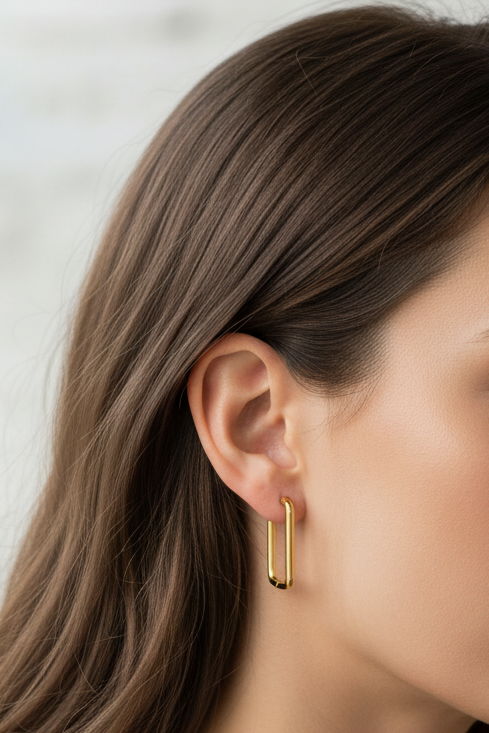 Woman wearing Melody earrings - lifestyle shot with correct size
