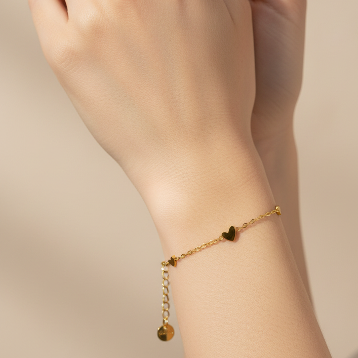 Woman wearing Whispy heart bracelet - lifestyle shot 